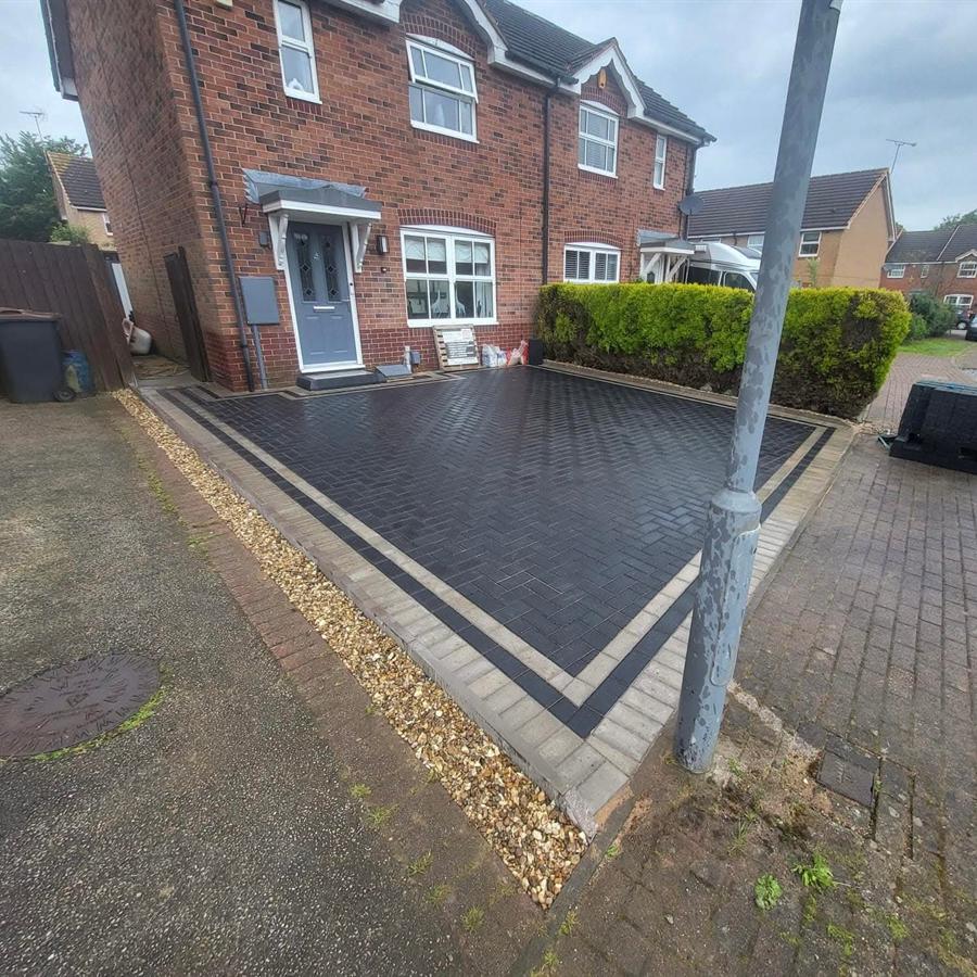 Block paved driveway with charcoal border