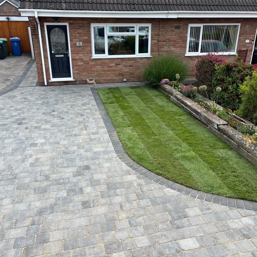 Bungalow driveway with shaped lawn
