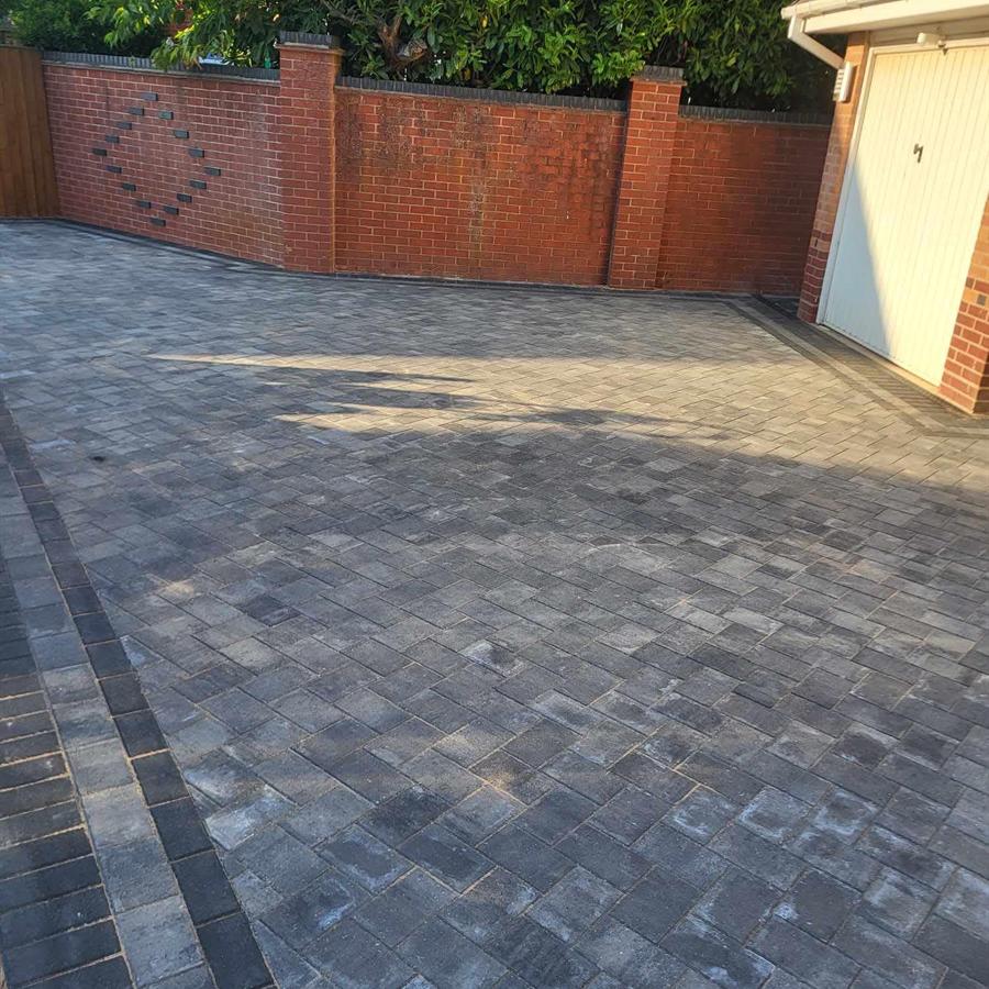 Brick boundary walls and block paving