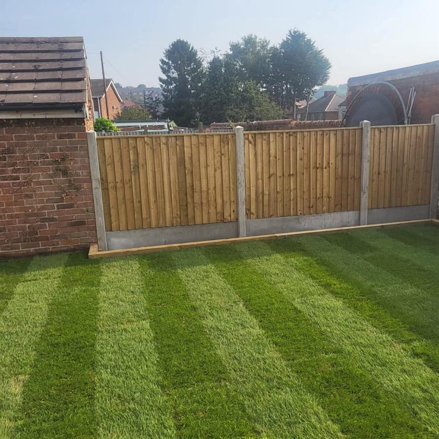New turf lawn and close board fencing