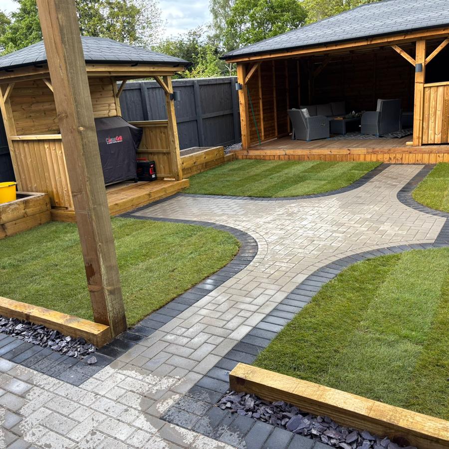 Landscaped garden with pergola seating area