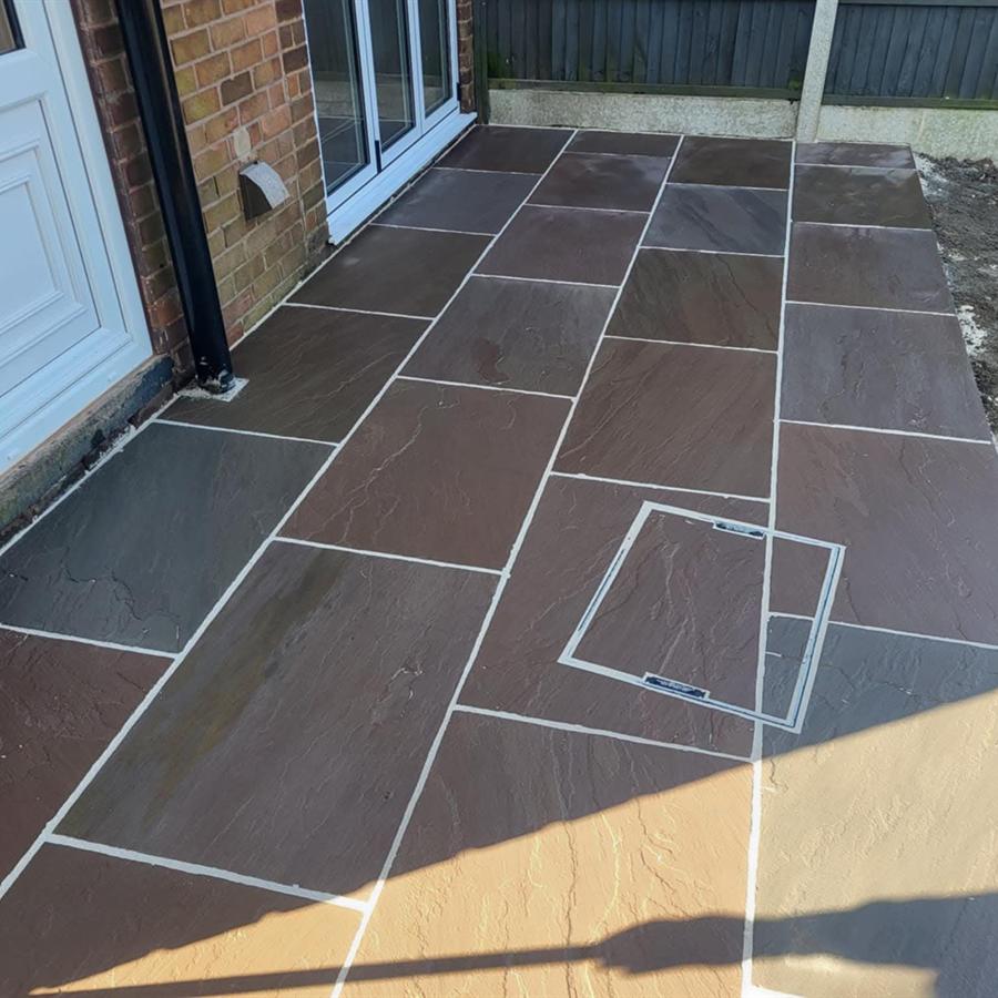 Grey sandstone patio with french doors