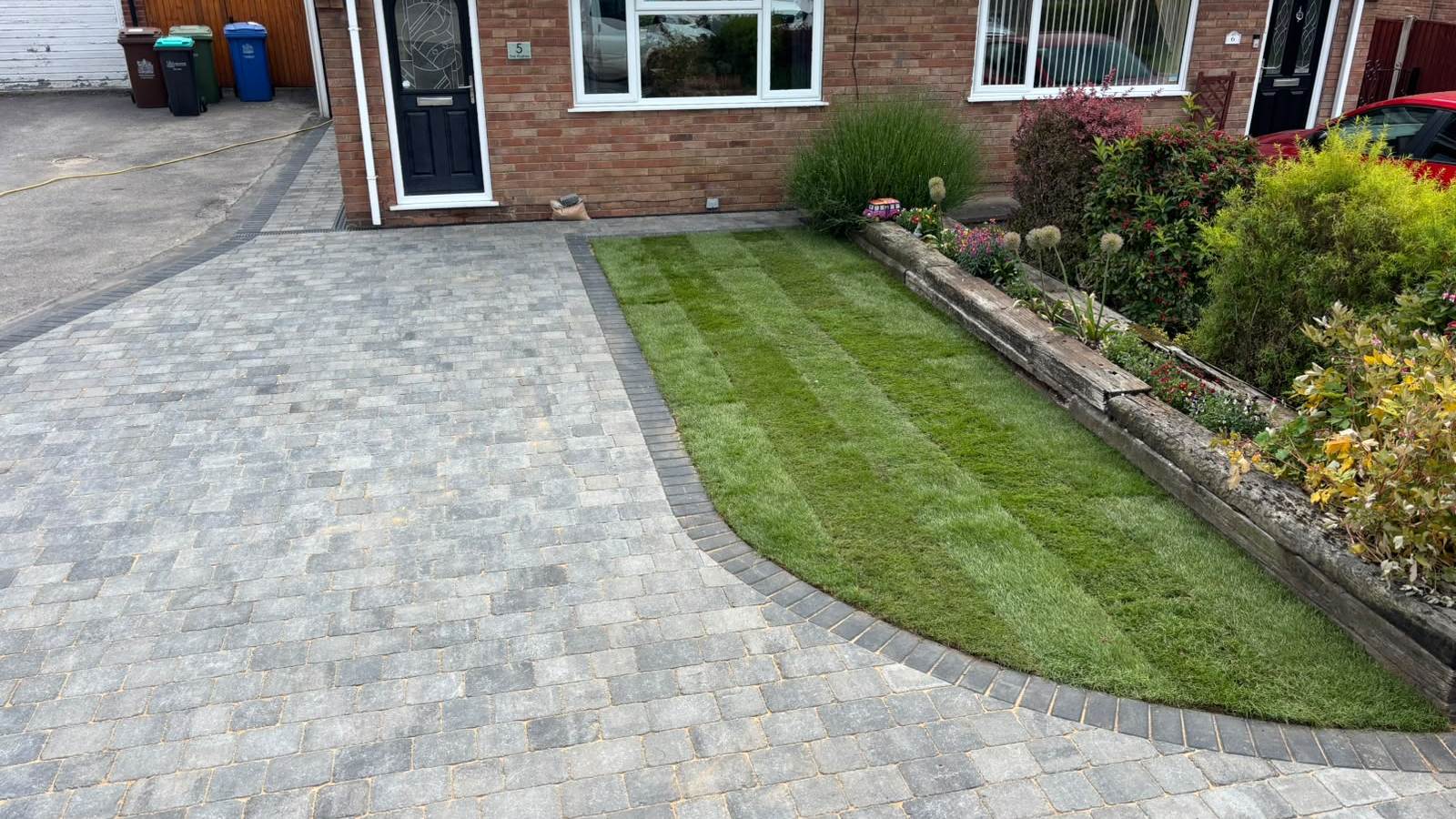 Block paved driveway with a shaped lawn edge at a bungalow in Mansfield
