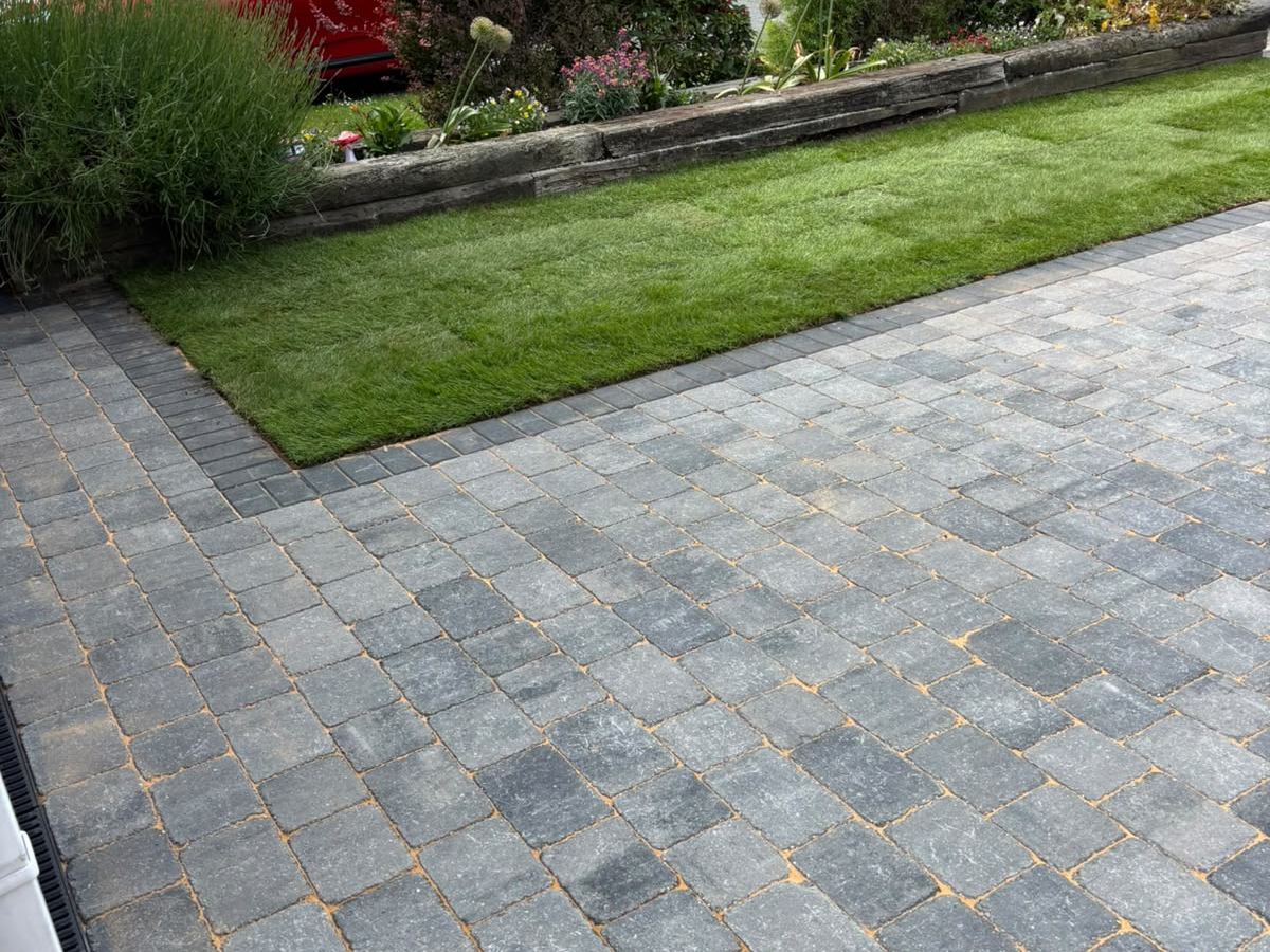 Block paving driveway with a lawn edge and planted border in Nottinghamshire