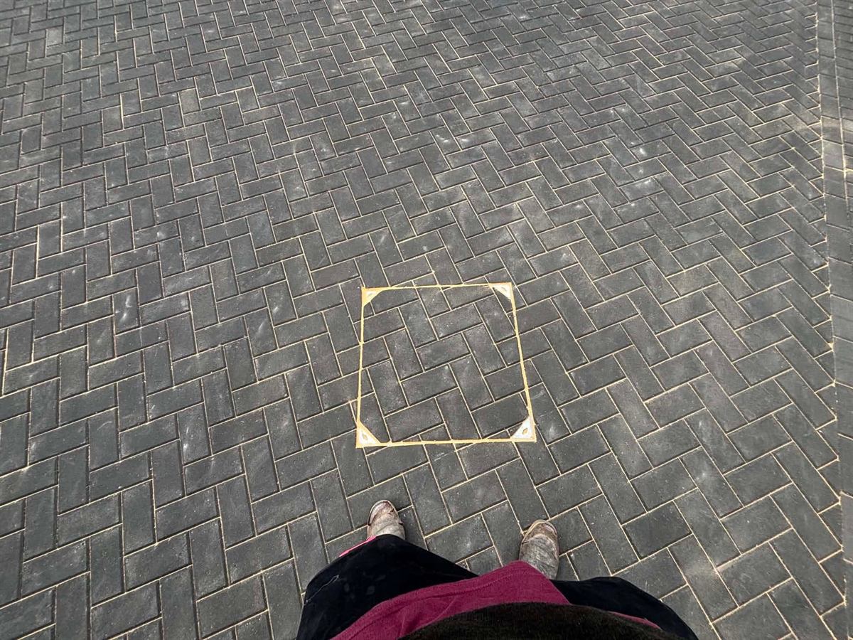 Dark block paving washed down with the joints re-sanded